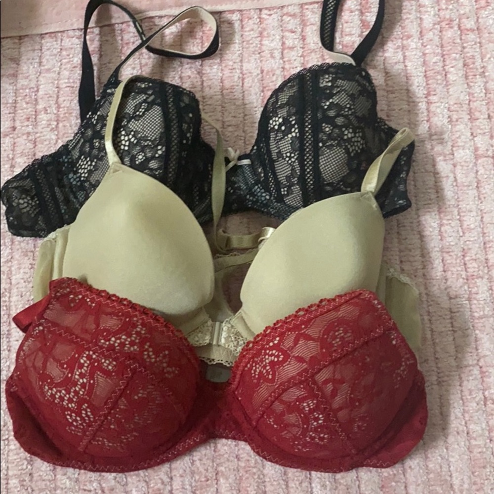 Three 32B bras - red, black and nude